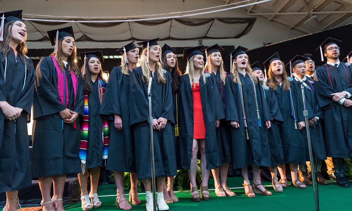 Students sing at commencement