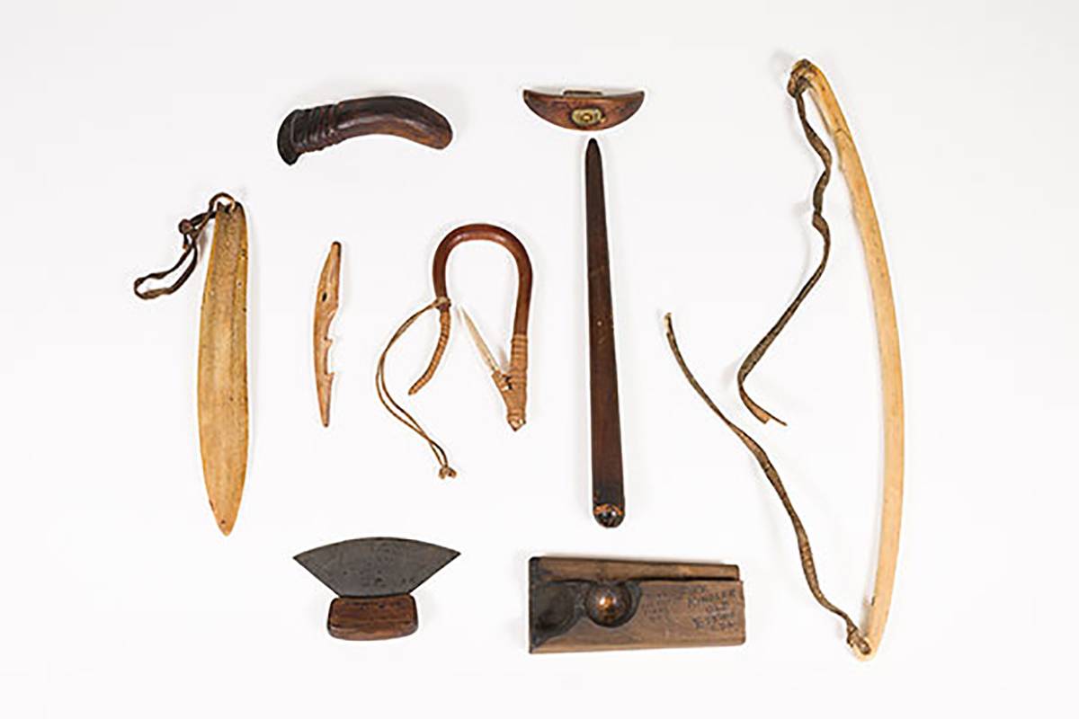 Collection of Inuit tools on white background
