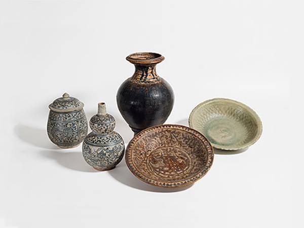 Intricate Thai pottery works on white background