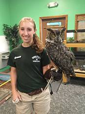 Sarah Sampson ’19 with an owl perched on her arm
