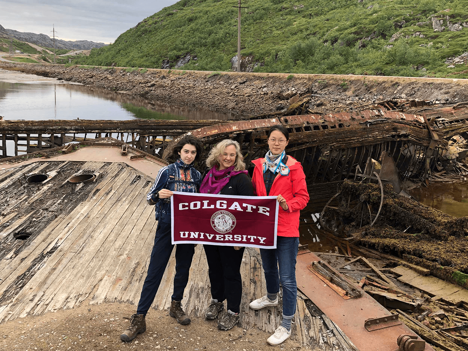 Student interns Yang Zhang and Isobel Hooker pose with Professor Graybill at their Russian research site, Teriberka.