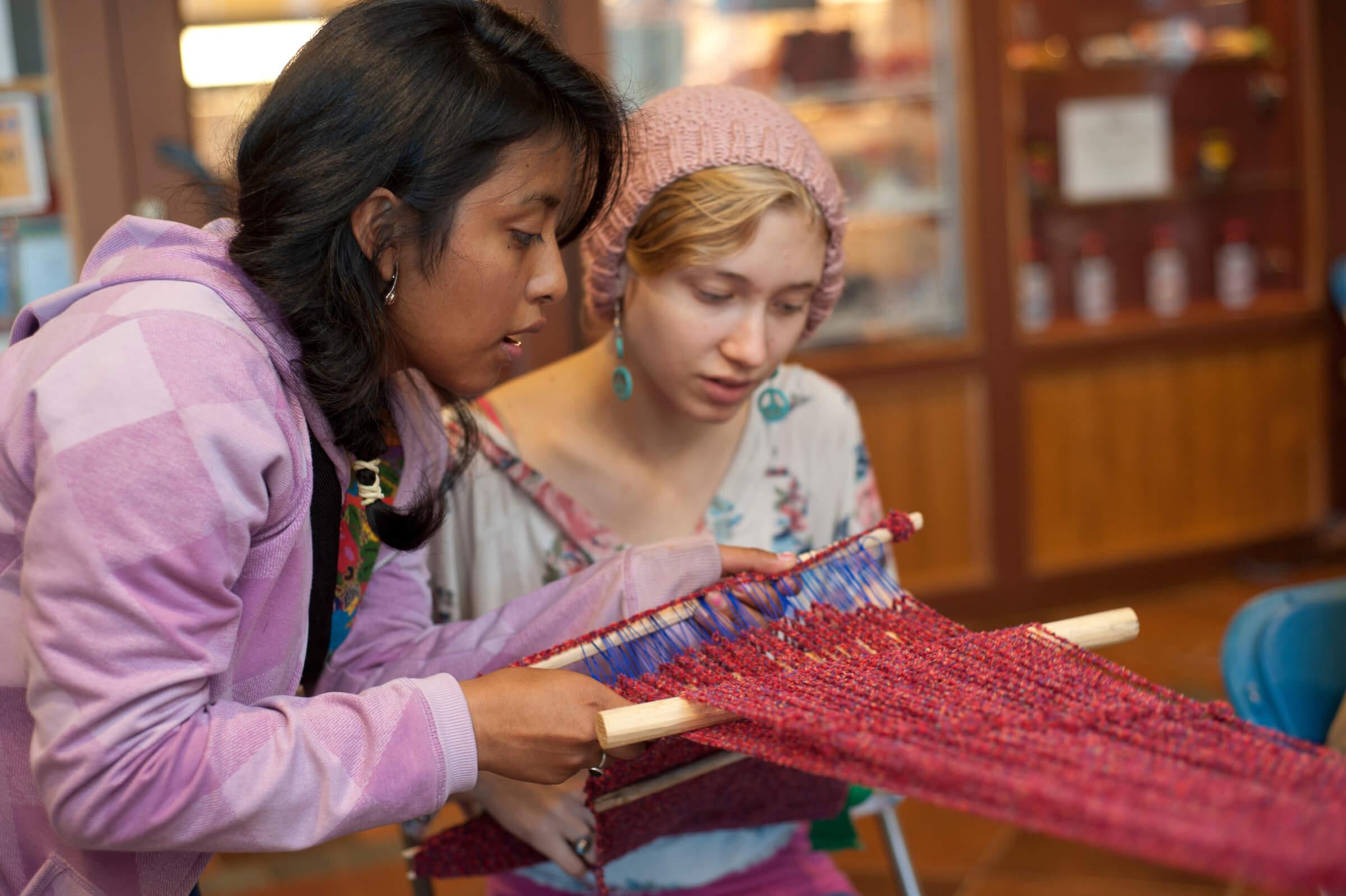 Students participate in a weaving demonstration during Colgate’s annual Native American Festival.