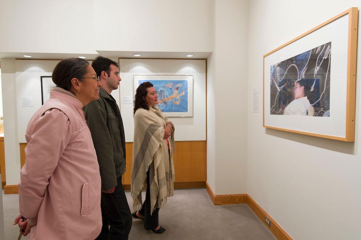 A family enjoys the display at the Longyear Museum Of Anthropology during family weekend.