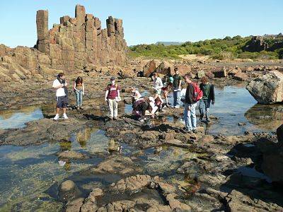 Study group exploring a volcanic landscape south of Wollongong at Bombo, New South Wales