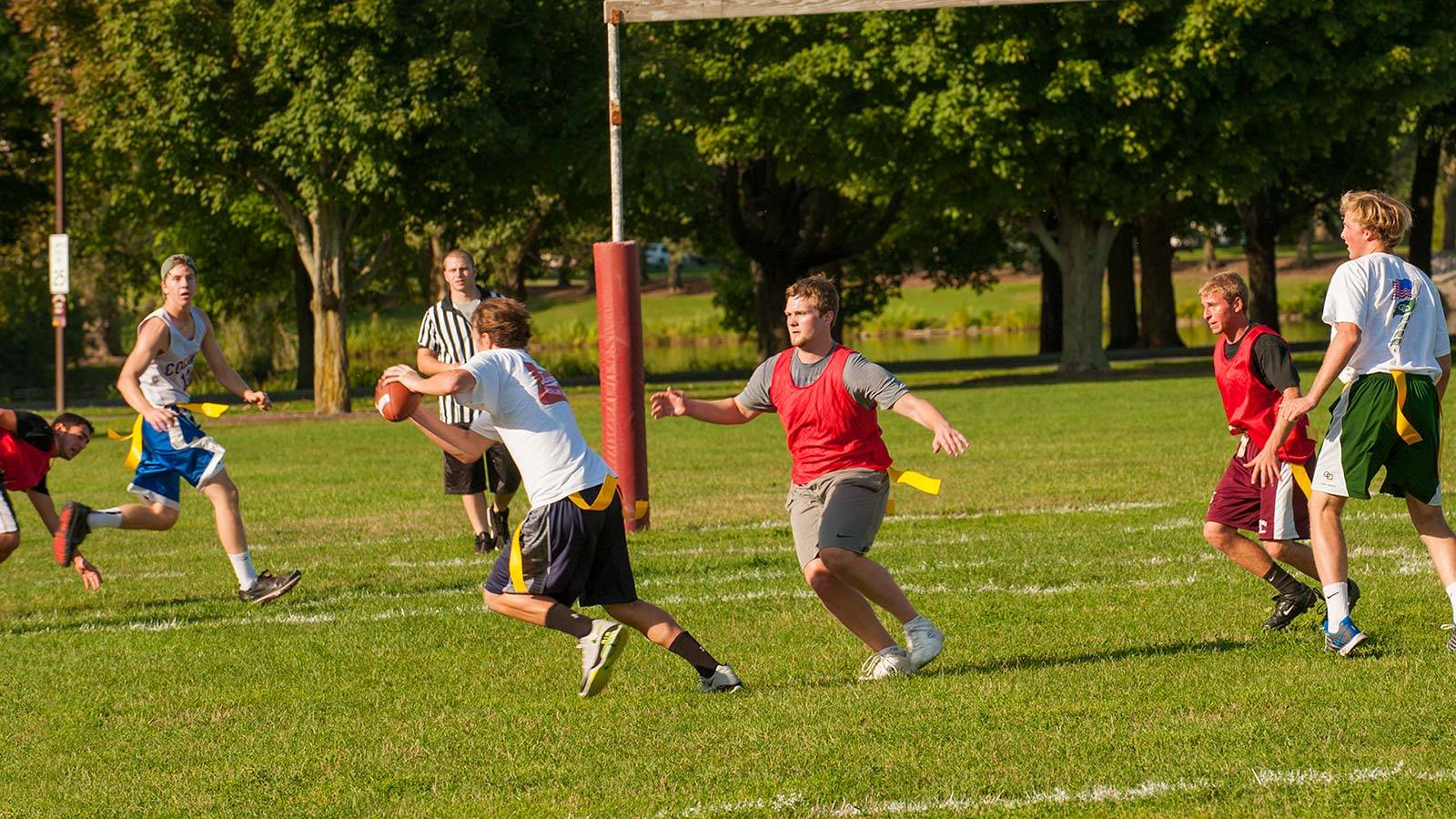 A student official watches a play unfold in intramural flag football