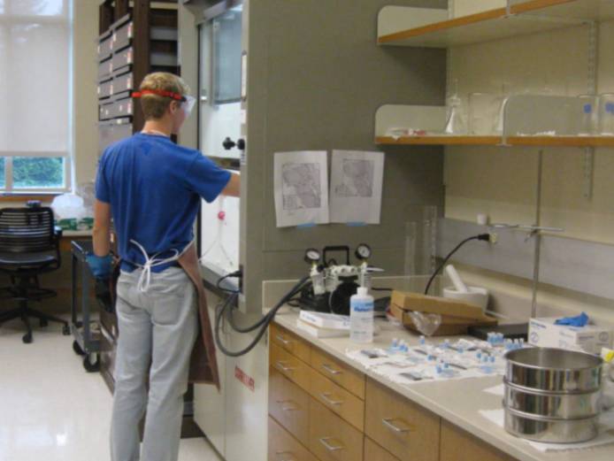 Student working in ventilation hood