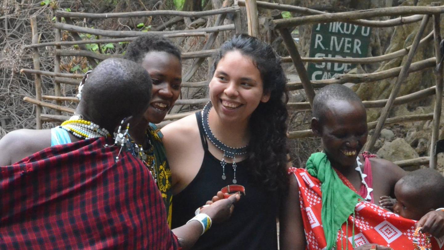 Student talks with Maasai women during geology research trip to Africa