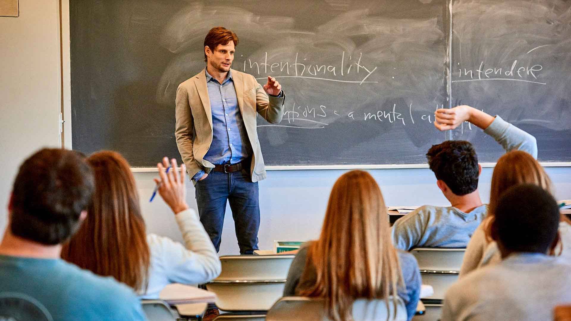 Faculty member lectures in a classroom