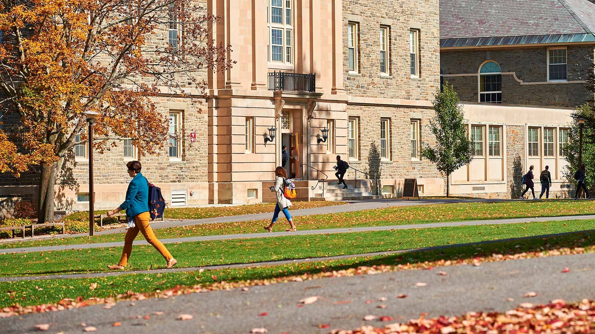 Students walk across the Academic Quad on a sunny autumn day