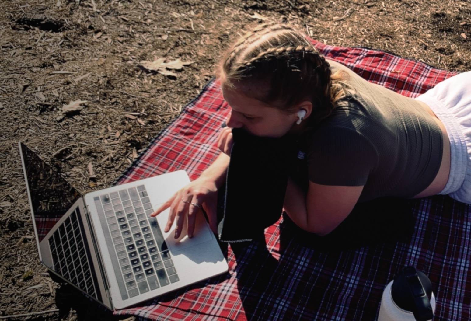 Jesse doing schoolwork on the cross country trails