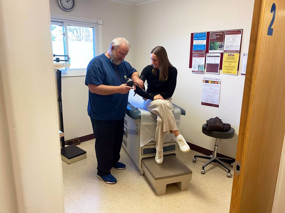 A student receives treat in Student Health Services