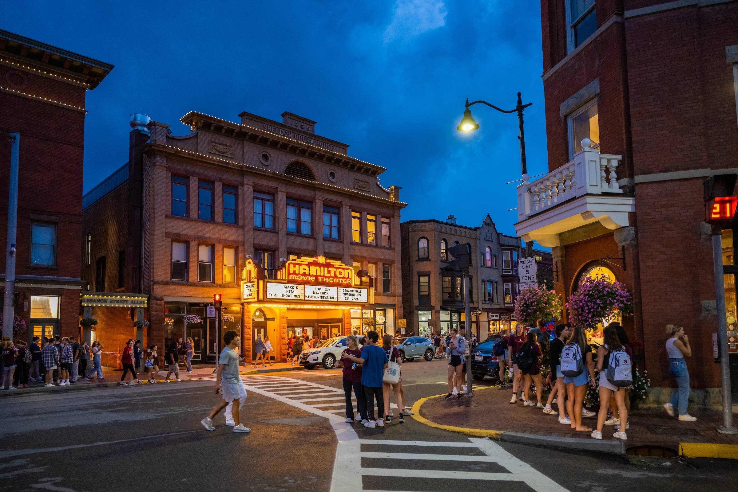 Students walk along downtown Hamilton in the evening