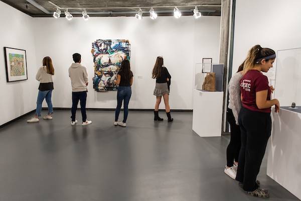 Students in the Picker Art Gallery viewing an exhibition