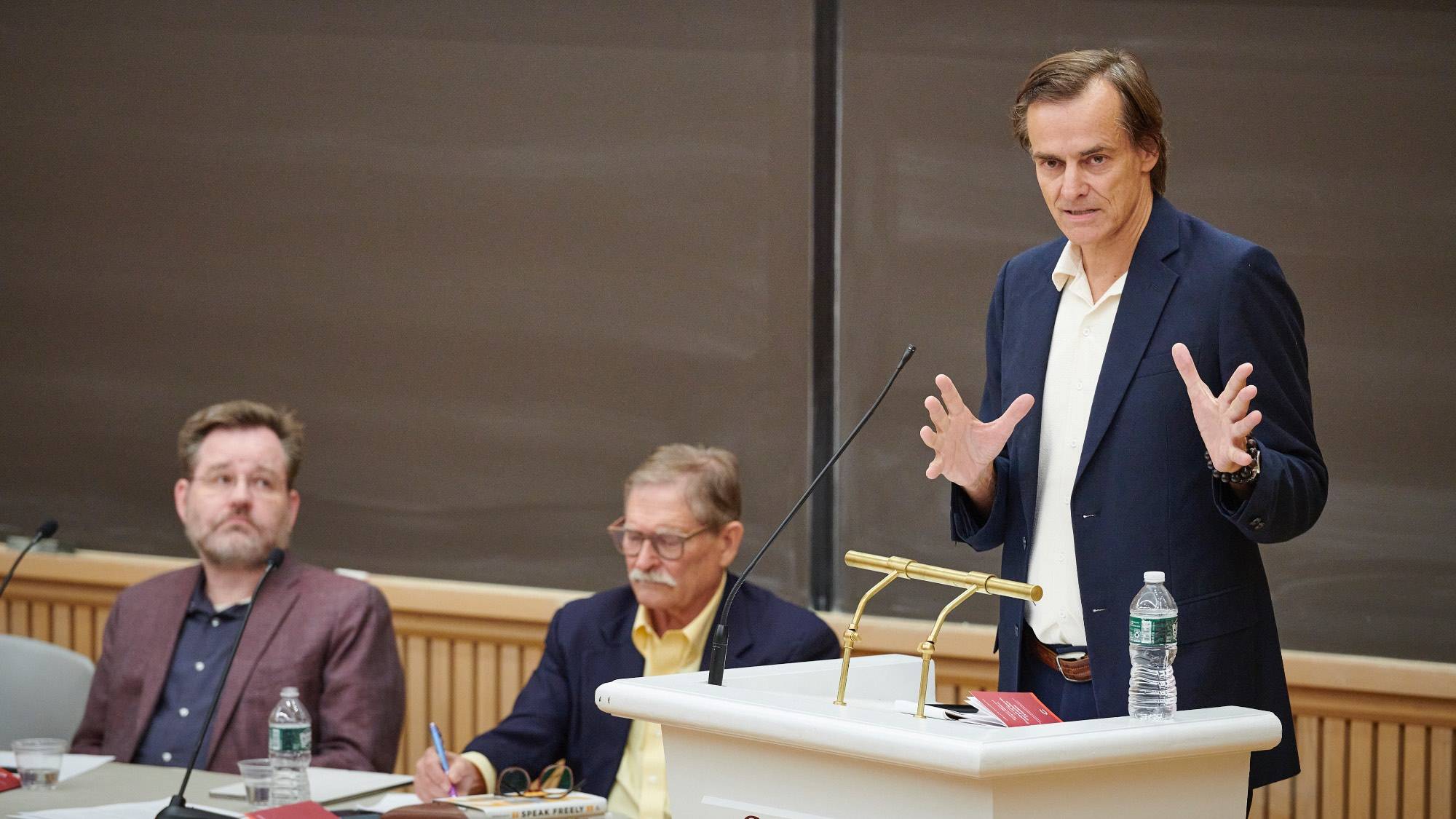 Ulrich Baer of New York University (right) speaks during the 2024 Constitution Day Debate Sept. 12, 2024, with Keith Whittington of Yale Law School (left) and debate moderator and Professor of Political Science Stanley Brubaker (center). 