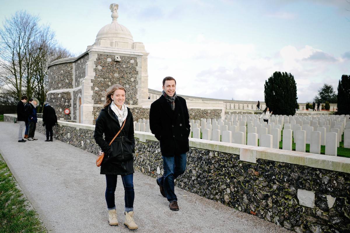 Two students walk near a war cemetery in Belgium