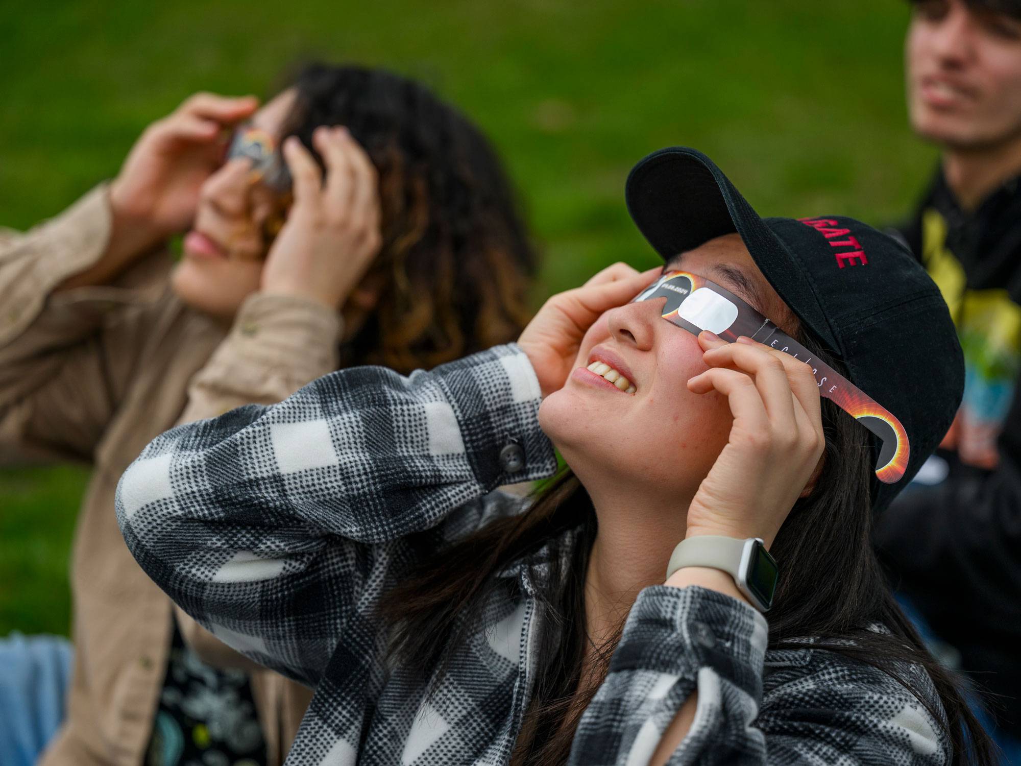 Students view eclipse through special glasses