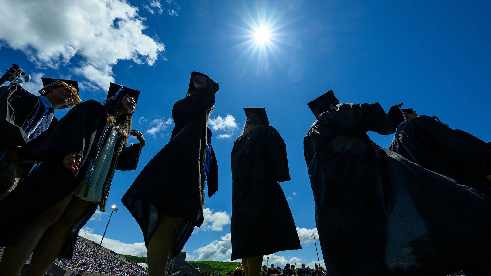 Students stand in a line during Commencement