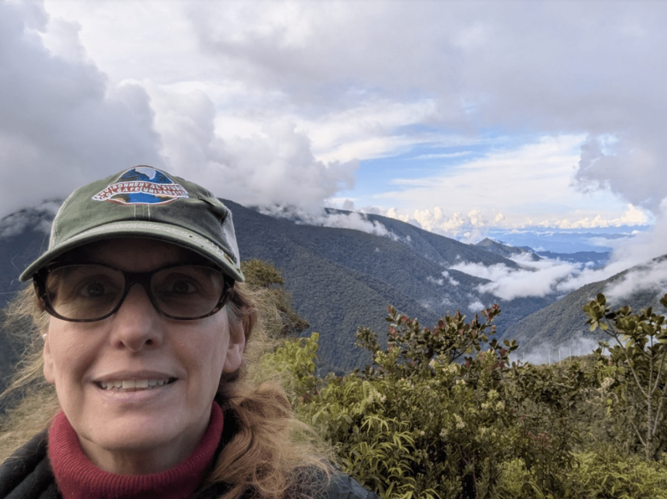 Professor Cardelus takes a selfie in front of mountains