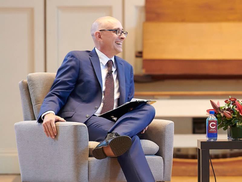 W. Bradford Wiley Chair in International Economics and Lampert Institute Director Chad Sparber seated during an interview with Karl Rove in the Colgate Chapel Sept. 16, 2024.