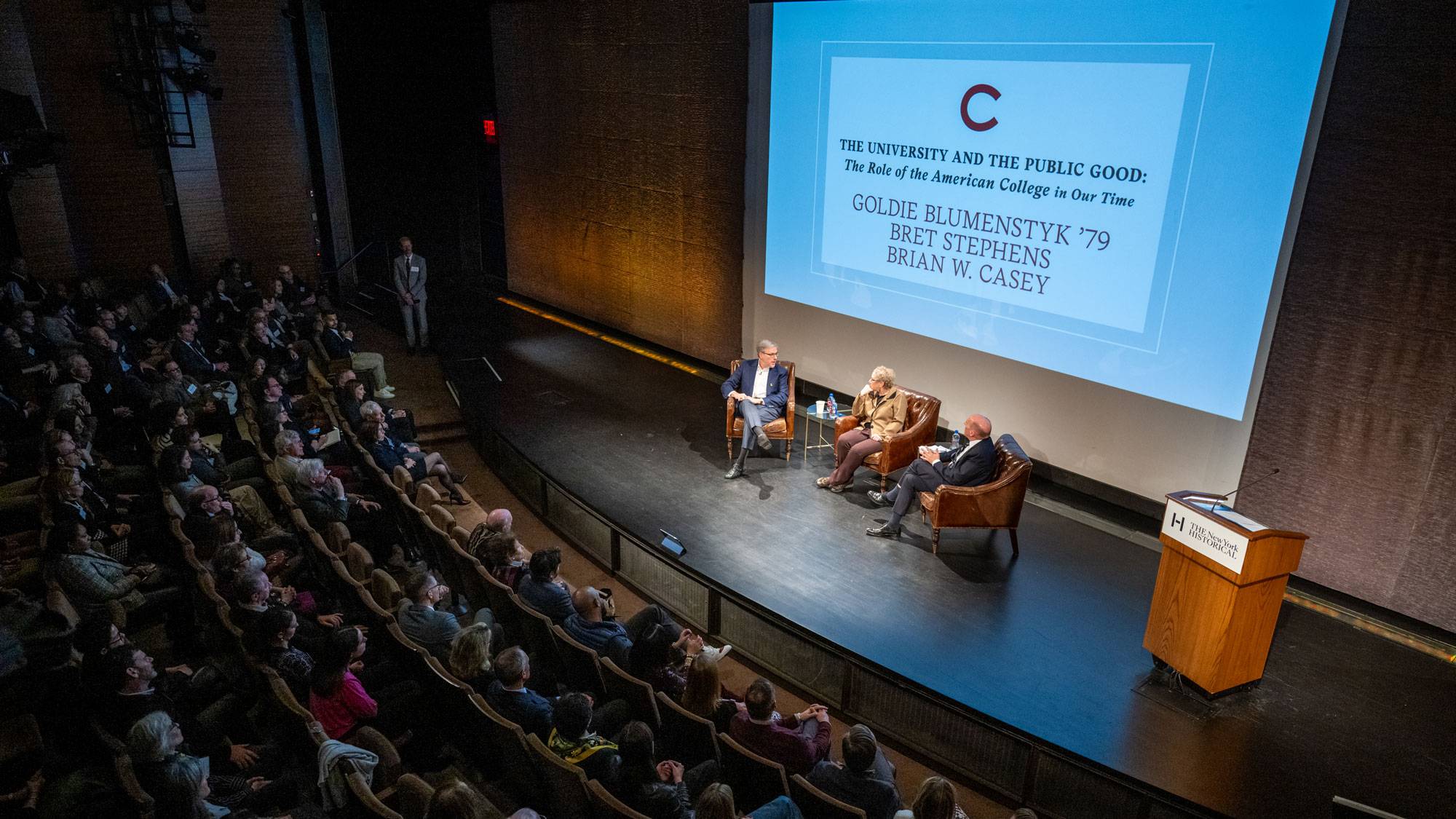 President Brian Casey, Bret Stephens, and Goldie Blumenstyk on stage in front of audience