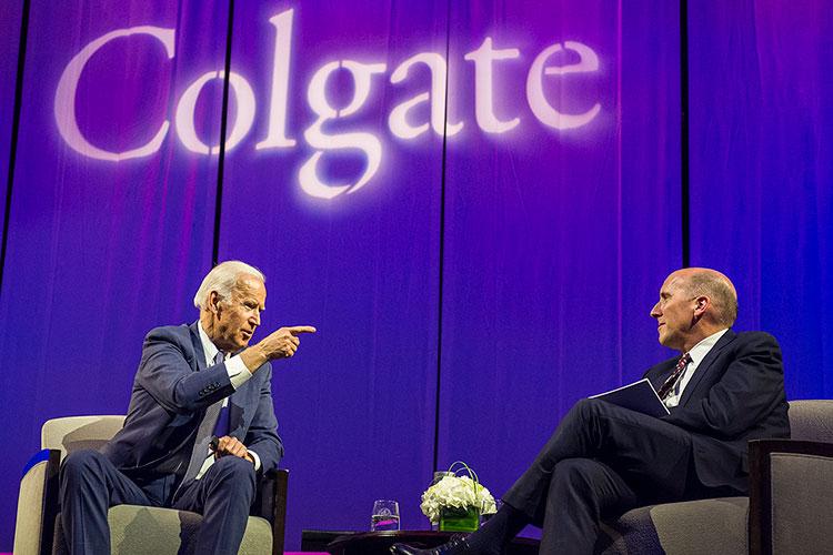 Former Vice President Joe Biden points his finger while chatting with Colgate President Brian W. Casey