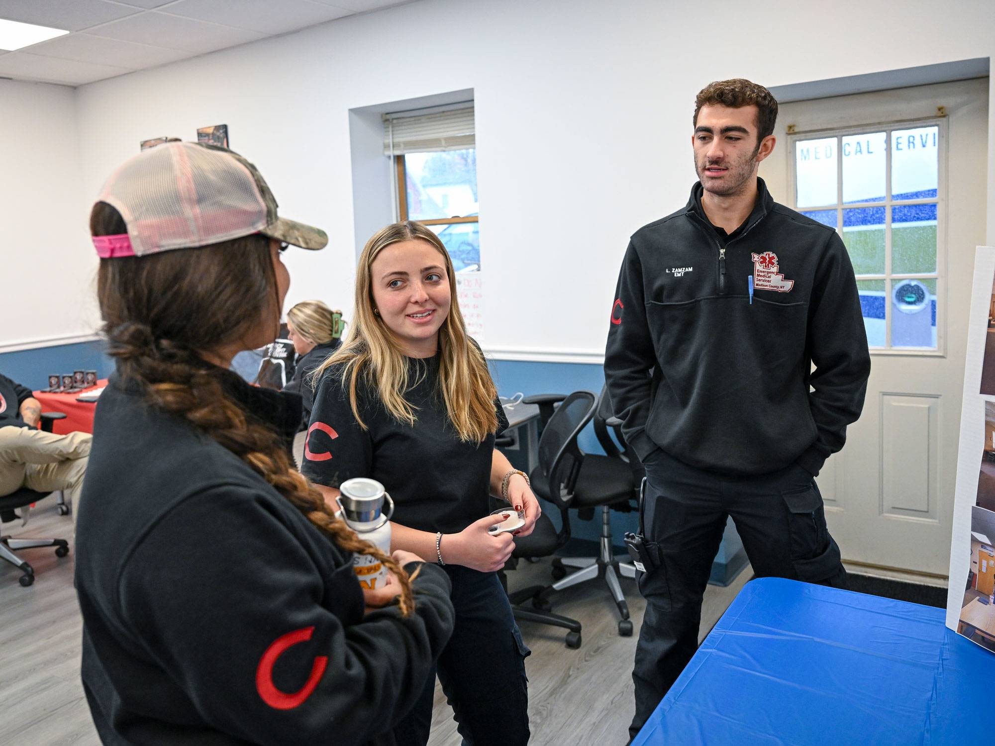 EMTs in conversation at event