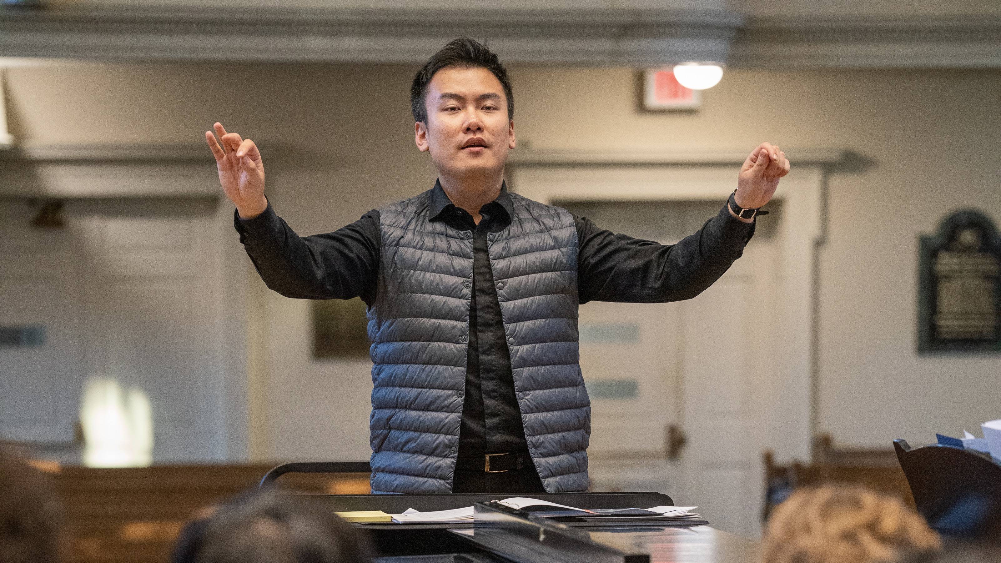 Professor Sinhaeng Lee conducting his choir in Colgate Memorial Chapel