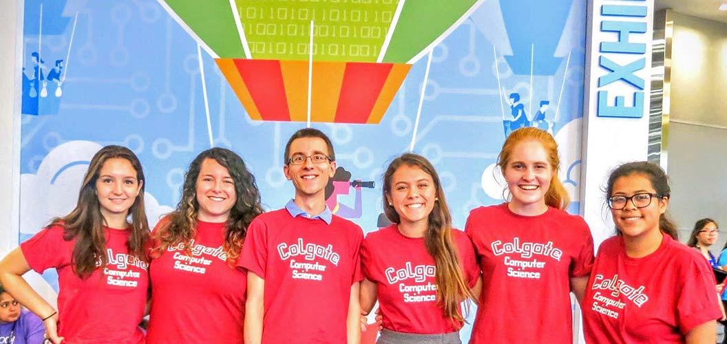 Students in matching red Colgate Computer Science t-shirts at the conference