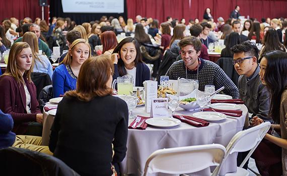 students and alumni talking